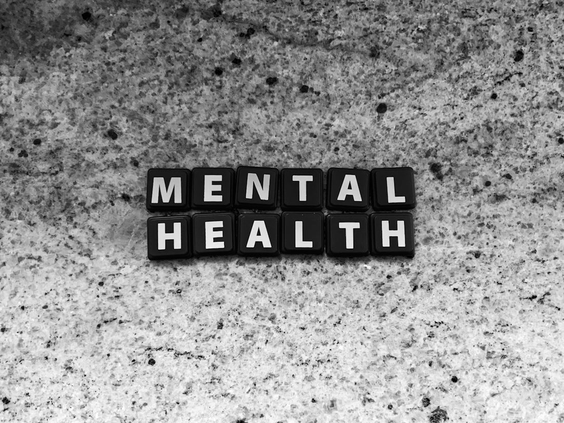 a black and white photo of the word mental health