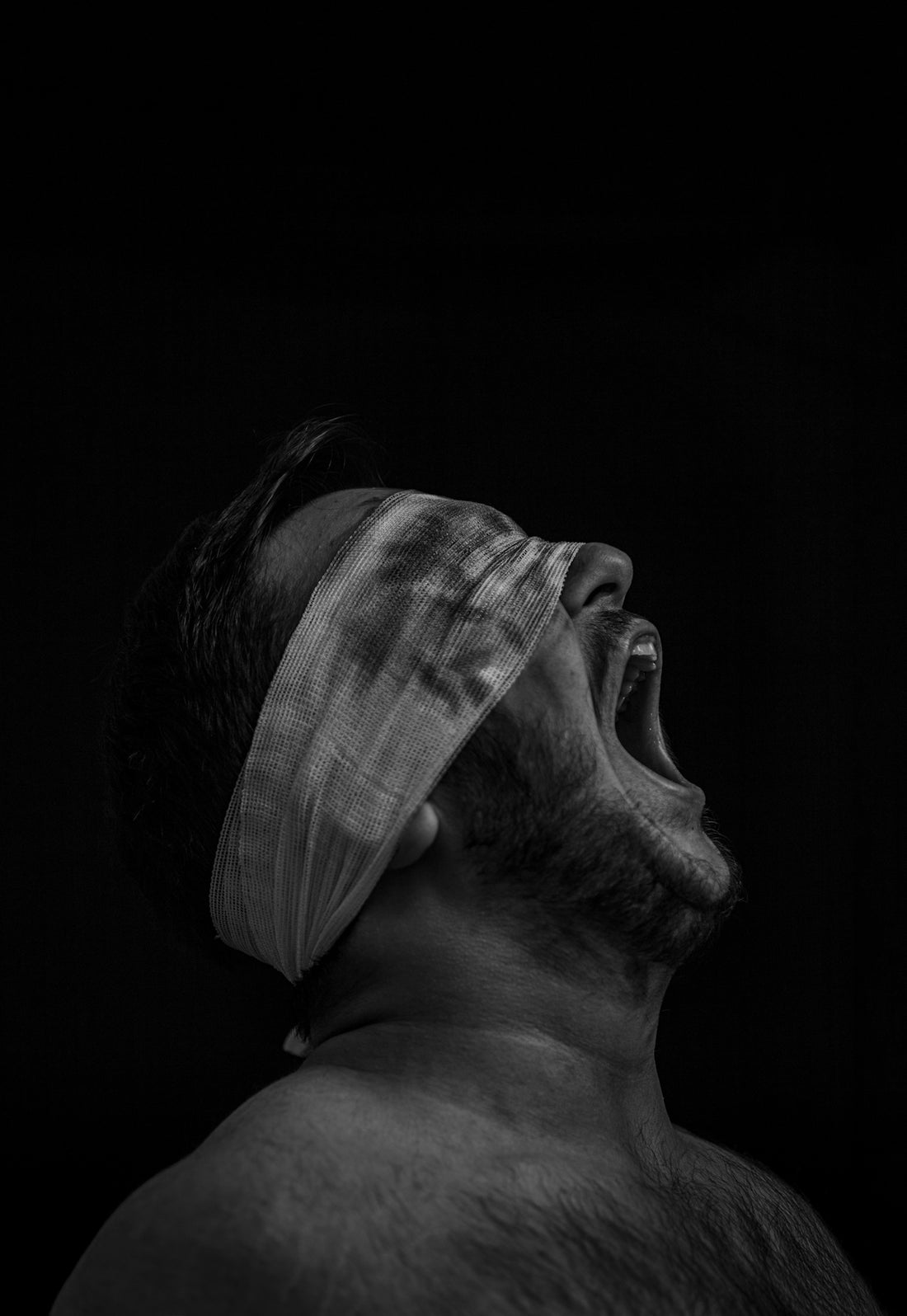 a man with a blind on his head