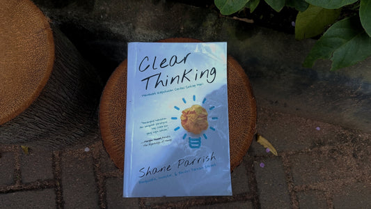 Book titled clear thinking with a lightbulb illustration.
