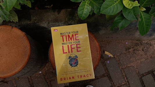 A yellow book titled master your time, master your life