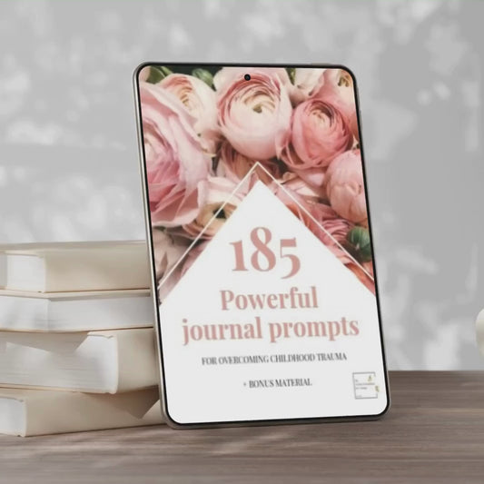 video mock up of front page of journal prompts for overcoming childhood trauma. this workbook contains 185 journal prompts and bonus material.