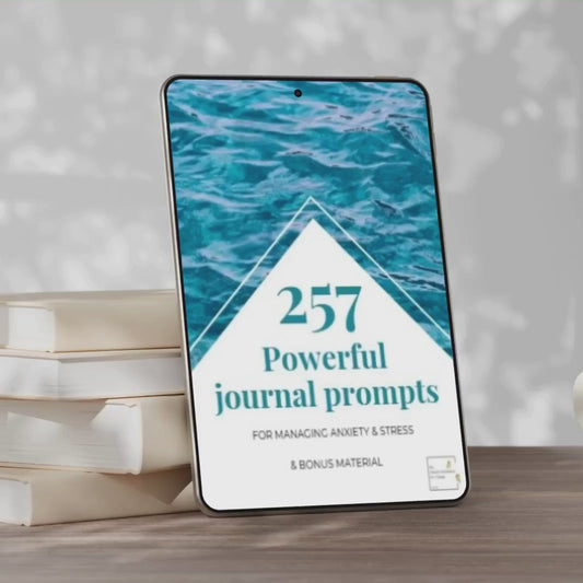 mock up of front page from our journal prompts for managing anxiety and stress. this workbook contains 257 journal prompts and bonus material.